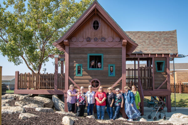 Members of the Epsilon Sigma Alpha sorority in front of the Heartspring wheelchair-accessible Treehouse