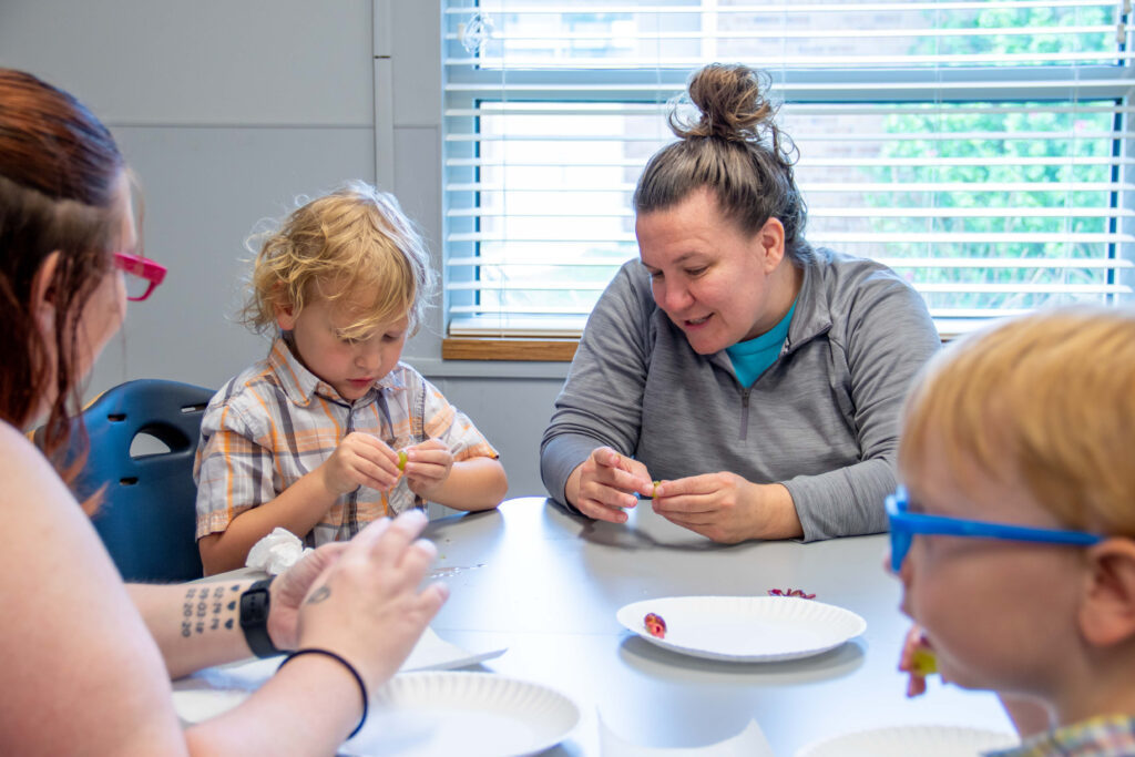 Heartspring feeding therapist and a client trying new foods in a pediatric feeding therapy session