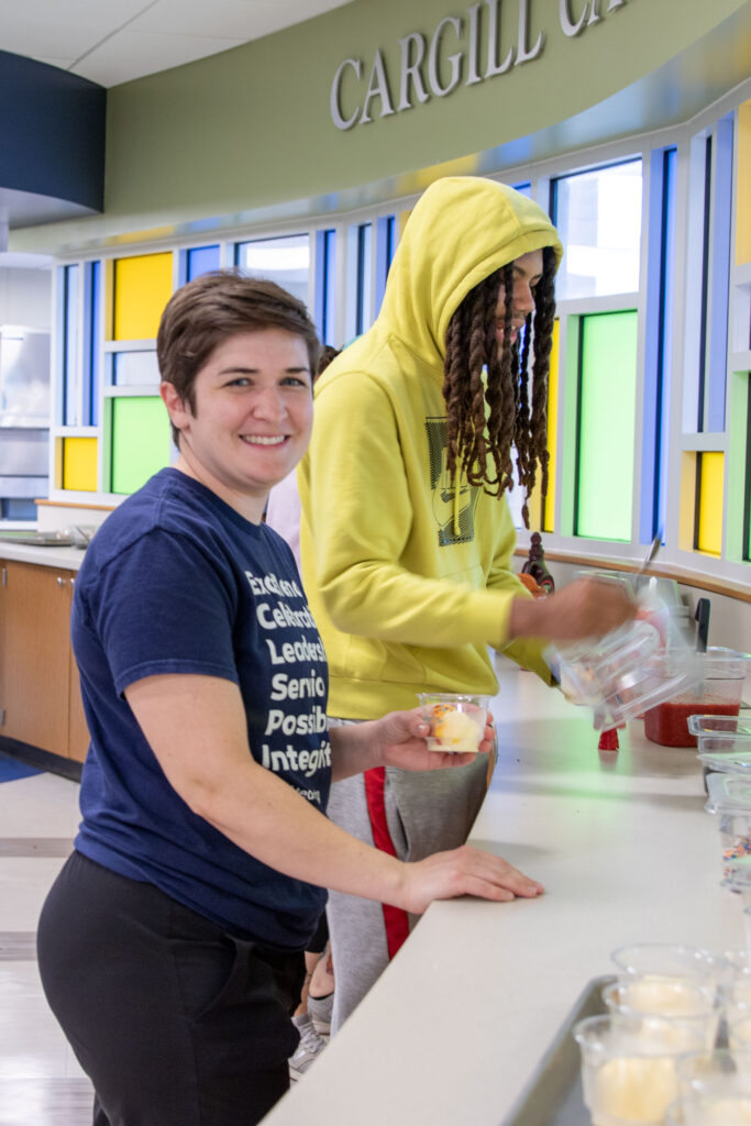 Heartspring employees getting ice cream in the cafeteria