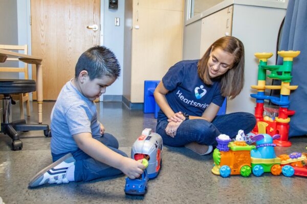 Heartspring speech-language therapist and client in an early intervention therapy session