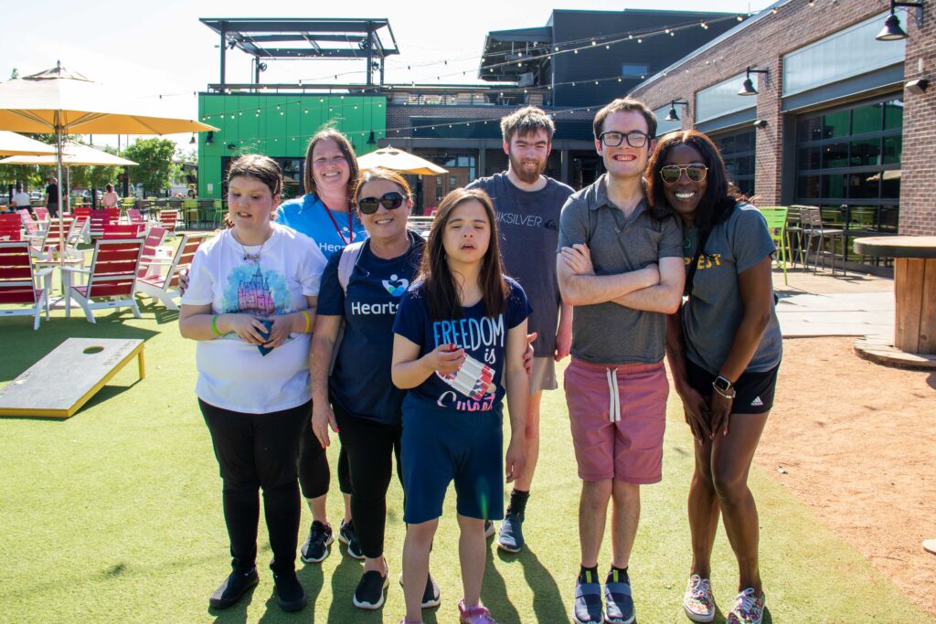 Group of Heartspring direct support professionals and students at Chicken N Pickle