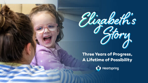 Young girl with glasses smiles at her pediatric occupational therapist. Text says, "Elizabeth's Story: Three Years of Progress, A Lifetime of Possibility"