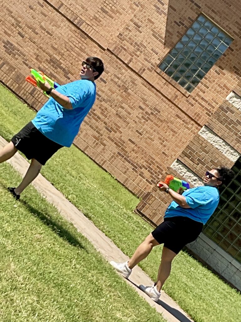 Heartspring Therapeutic Residential & Day School staff play with water toys at Family Field Day.