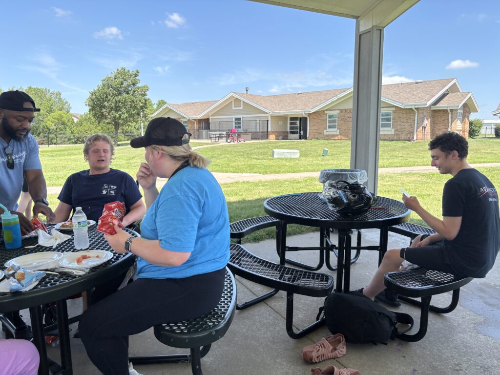 Heartspring Therapeutic Residential & Day School students and staff enjoy lunch at Family Field Day.