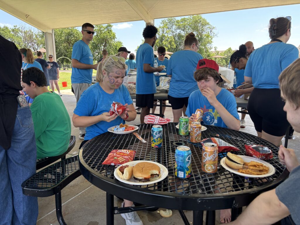 Heartspring Therapeutic Residential & Day School students and staff enjoy lunch at Family Field Day.