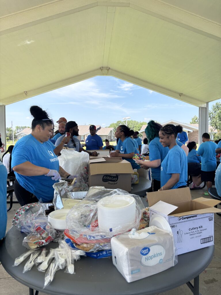 Heartspring Therapeutic Residential & Day School students and staff wait in line for food at Family Field Day.