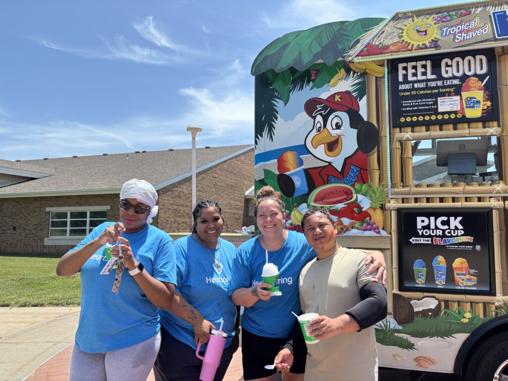 Heartspring Therapeutic Residential & Day School students and staff enjoy snow cones to cool off at Family Field Day.