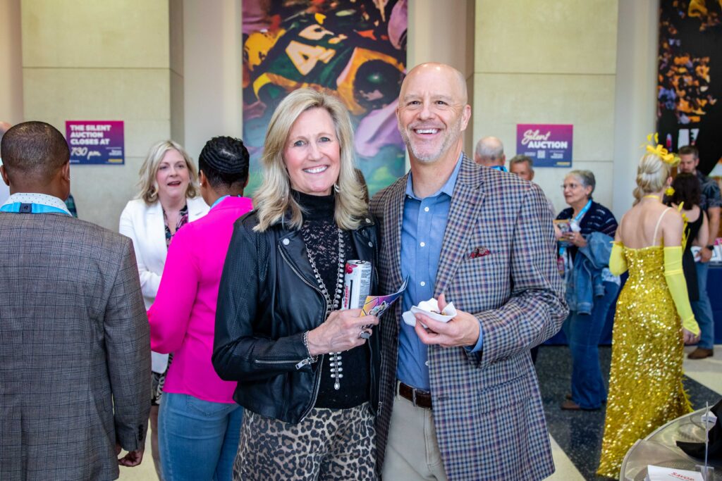 Two Heartspring Gala guests smiling and posing for a photo
