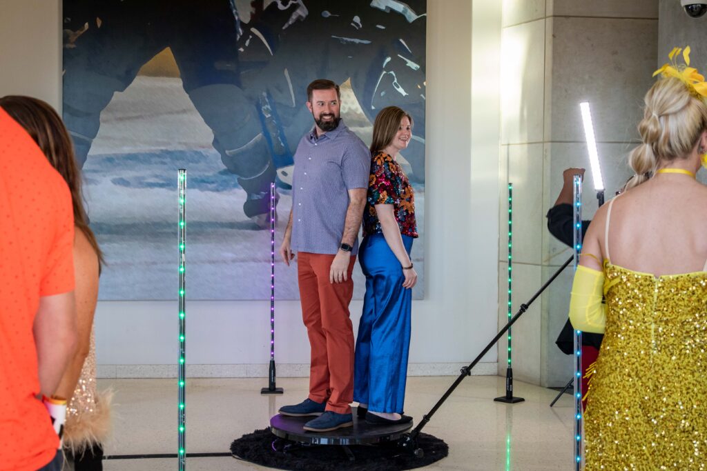 Two Heartspring Gala guests standing in the middle of a photo booth