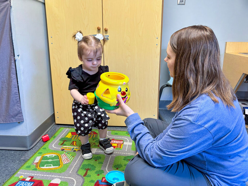 Heartspring speech-language therapist and client working in an early intervention therapy session