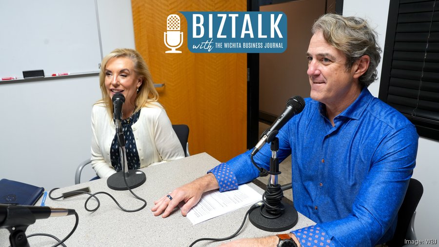 Heartspring President & CEO, Dan Soliday, and Heather Hogan, Heartspring's Chief Advancement & Startegy Officer discuss Heartspring's downtown healthcare corridor expansion with the Wichita Business Journal at a white table behind two podcast microphones.