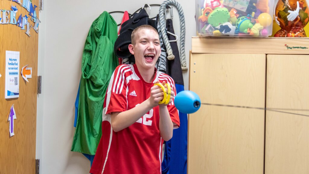 Brandon, a Heartspring Pediatric Outpatient Clinic client, works on occupational therapy skills.