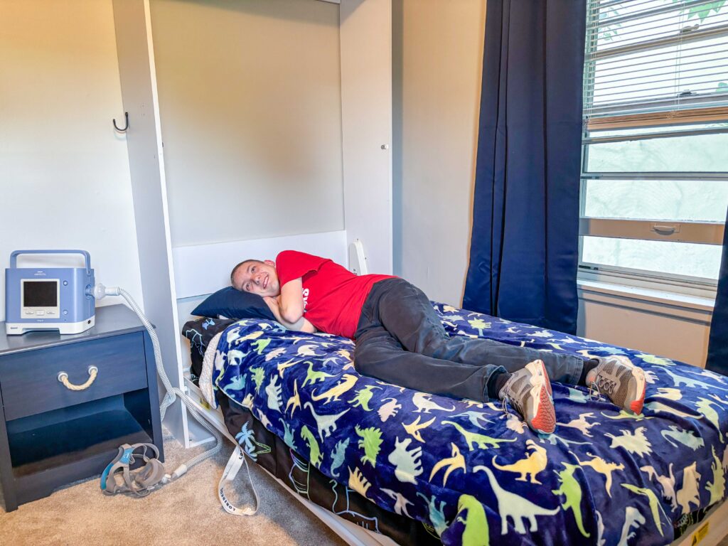 Brandon, a Heartspring Pediatric Outpatient Clinic client, enjoys his new Murphy bed solution, thanks to engineering students at Wichita State University.