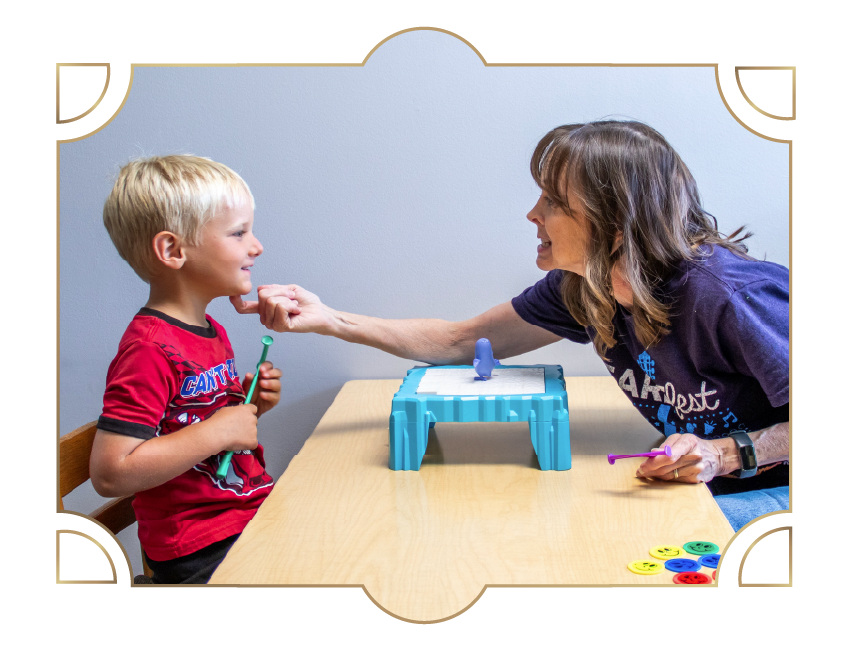 Heartspring speech-language therapist working with a client