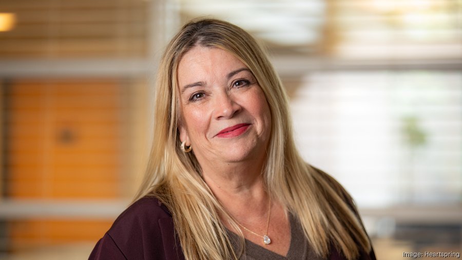 Heartspring's Vice President of Advancement Jamee Ross smiles in her professional portrait.